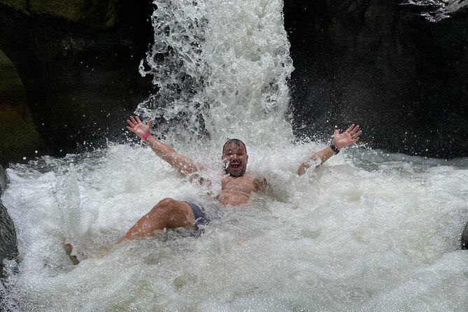 El Yunque: Waterslide and Plus Beach Round Trip - The rainforest stop: a short hike with a slippery reward