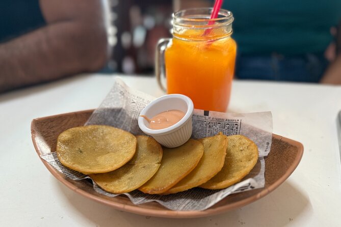 Old San Juan Food Tour with 7 Tastings of Authentic Local Flavors - Plaza Colón starts the story