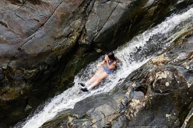 Private El Yunque Tour to Waterslide and Waterfalls - Swimming Beneath the Waterfalls