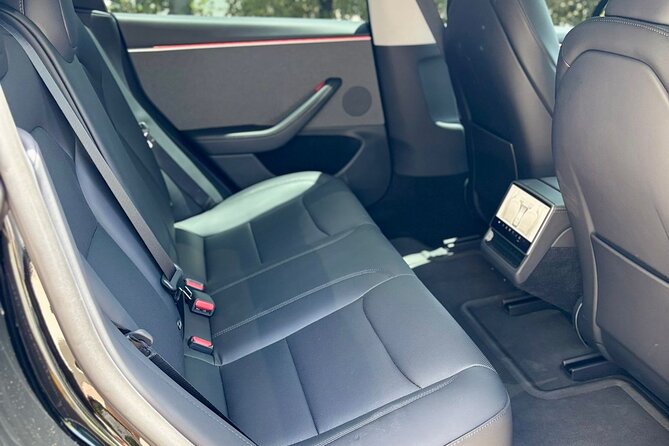 Puerto Rico Island Wide Private Transfers, Tesla 3 Luxury Sedan. - Leaving San Juan Airport without the taxi scramble