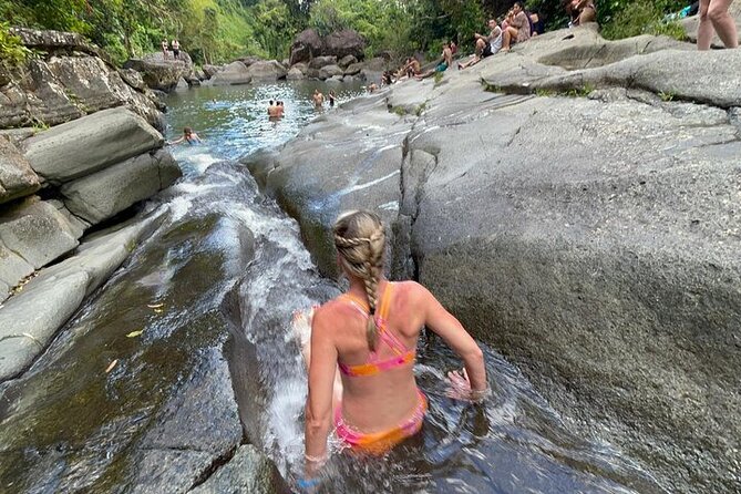 Rainforest Zipline, Luquillo Beach, and Natural Springs Day Trip - The natural spring and rock waterslide