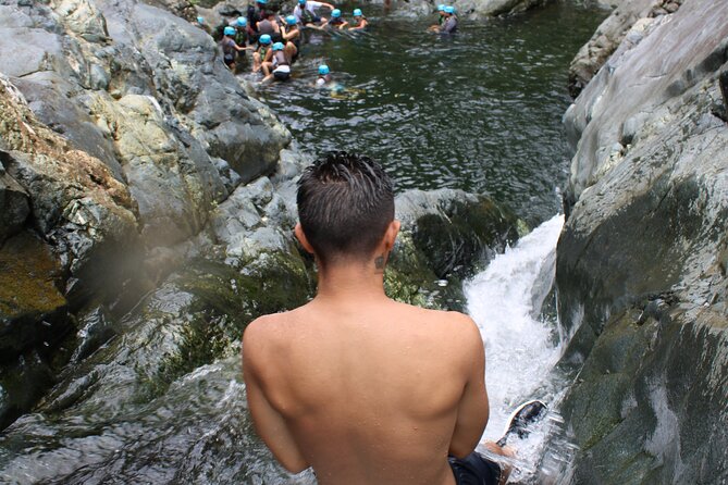 Small-Group El Yunque Waterslide Adventure & transportation - Natural waterslides and waterfalls