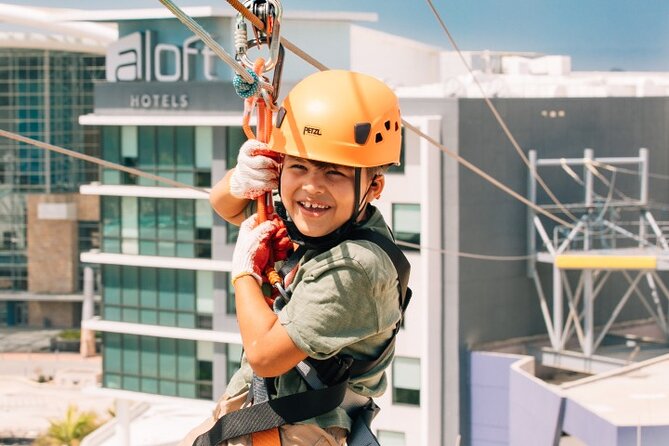 Zipline Sky Bull in Urban Environment in Toroverde urban park San Juan - Lights, screens, and the T-Mobile District setting